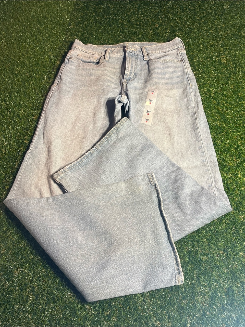 Old Navy size 8, mid rise loose boot cut. Light wash.